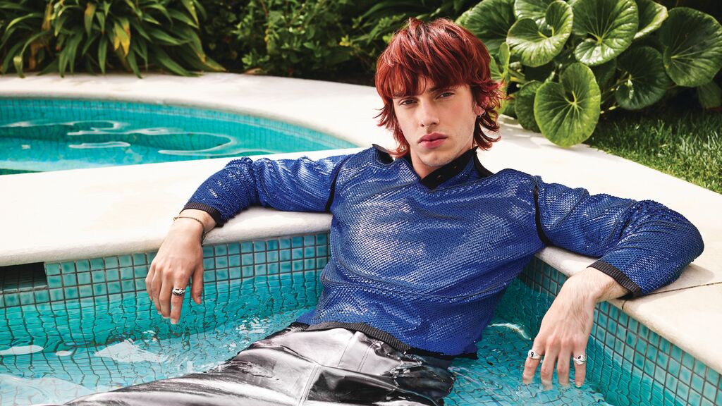 POOLSIDE - Male model by pool with red coloured hair