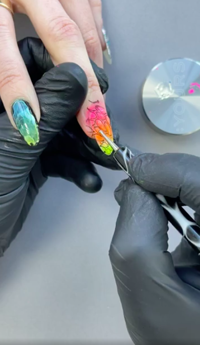 Neon lizard nail art application